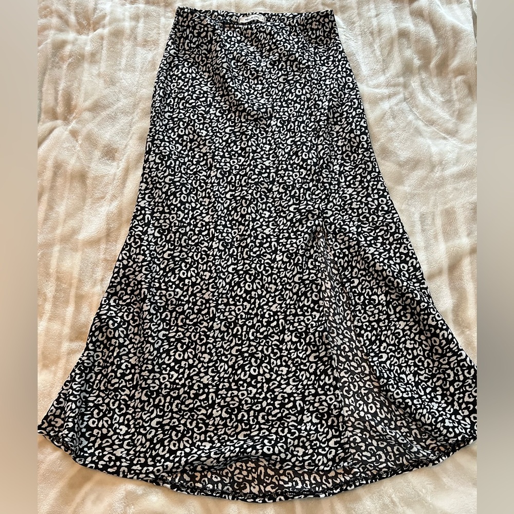 Mid length black and white leopard skirt with split